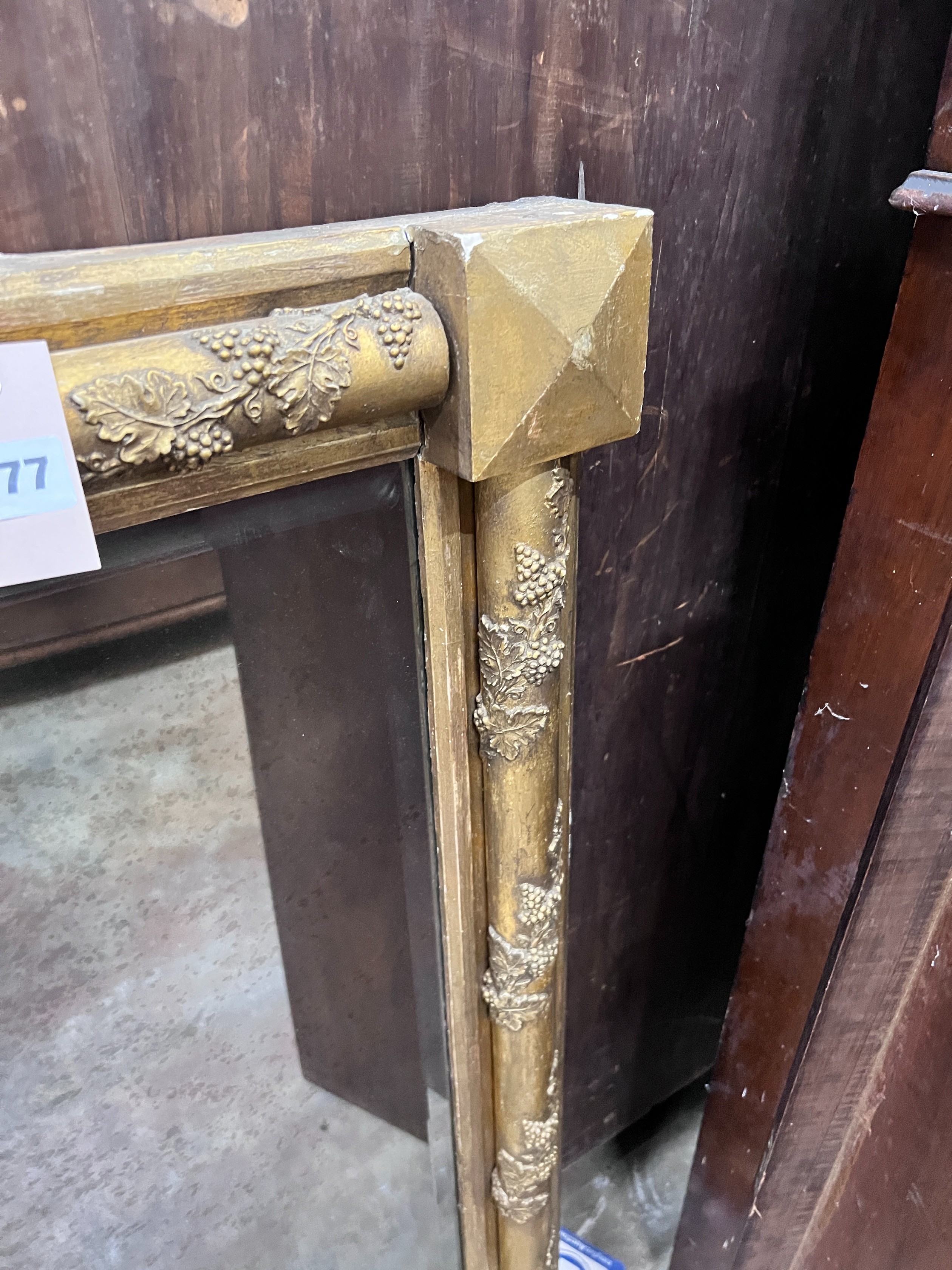 A Victorian gilt gesso and carved wood wall mirror, with vineous scroll borders, width 141cm, height 95cm *Please note the sale commences at 9am.